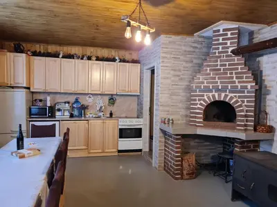 a kitchen with a brick ovenasteryasteryasteryasteryasteryasteryasteryasteryasteryastery at Вила Вайлин in Batak