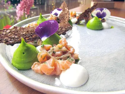 a plate of food with shrimp and other desserts at Jasmine Central Apartment in Sofia