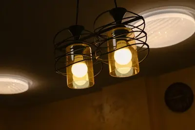 a chandelier hanging from a ceiling with lights at Hotel Leda in Sofia