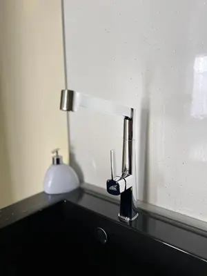 a close up of a bathroom sink with a lamp at Flower house 4 in Sofia