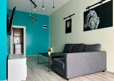 a living room with a couch and a table at Flower house 4 in Sofia