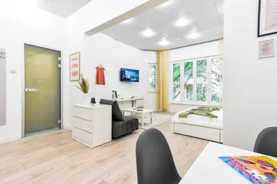 a living room with a bed and a desk at Duplex Condo Prime Location 2BTH 2 Studios in Sofia