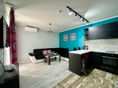 a room with a kitchen and a living room at Flower house 7 in Sofia