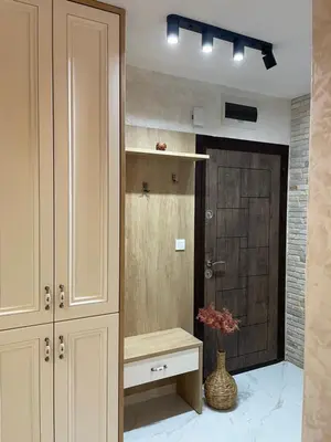 a room with a closet with a bench and a door at Boutique apartment Bansko Bell Tower in Bansko