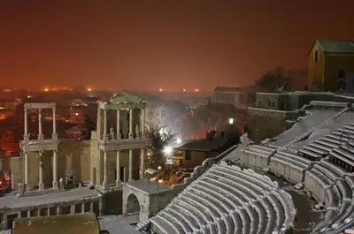 an amphitheater at night with snow on the ground at Апартамент Ламартин- в сърцето на Пловдив in Plovdiv