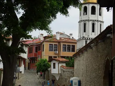 a group of buildings with a clock tower at Апартамент Ламартин- в сърцето на Пловдив in Plovdiv