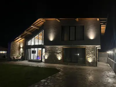 a building at night with lights on it at Къщи за гости Авена и Авена 2 in Banya