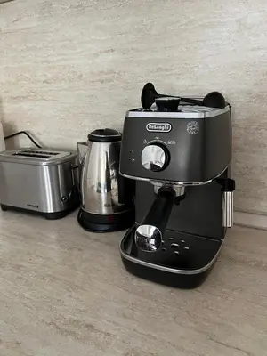 a black coffee maker sitting on top of a counter at Ski & Relax Apartments in Bellevue Residence in Bansko