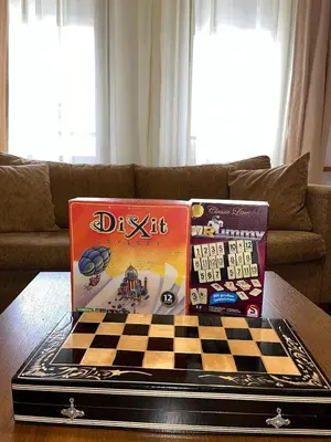 a chess board on a table in a living room at Ski & Relax Apartments in Bellevue Residence in Bansko