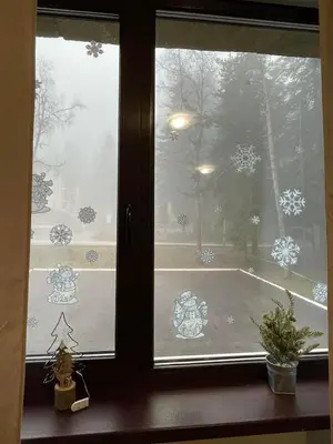 a window with a view of a snow covered yard at Apartment E23 Borovets Gardens in Borovets