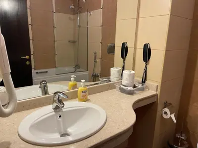 a bathroom counter with a sink and a mirror at Мия 3 Спа хотел Свети Спас in Velingrad