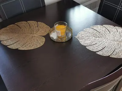 a glass of orange juice sitting on top of a table at Apartment Sam in Grand Monastery in Pamporovo