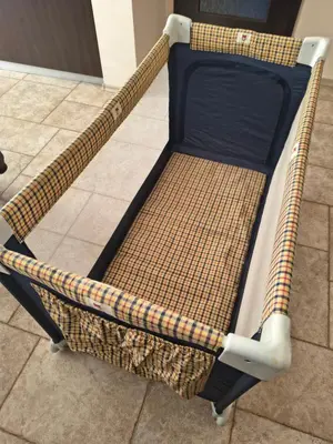 a bed frame sitting on the floor in a room at Слънчев апартамент с прекрасна гледка, паркинг. in Smolyan