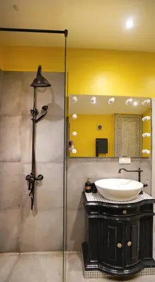 a bathroom with a sink and a mirror at Modern and Spacious 3-Bedroom Entire House in Sofia