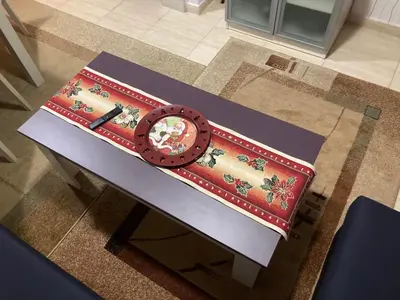 a table with a wheel on top of it at Grand Monastery Apartment in Pamporovo