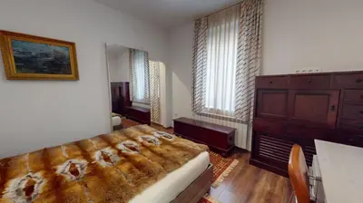 a bedroom with a large bed and a dresser at A Lovely 2BR Apartment in the heart of Sofia - NDK in Sofia