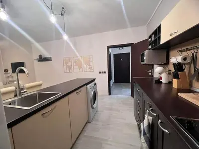 a kitchen with a sink and a dishwasher at The Tower - Lovely apartment @ Bansko Royal Towers in Bansko