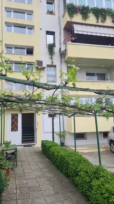a building with a bench in front of it at Апартамент Мегилукс 2 in Blagoevgrad