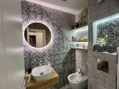 a bathroom with a sink and a mirror at Апартамент Мегилукс 2 in Blagoevgrad