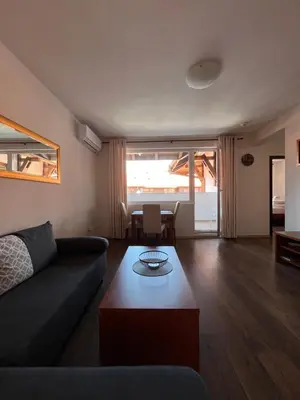 a living room with a couch and a table at Bansko Royal Towers 253 in Bansko
