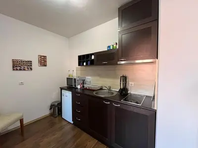 a kitchen with a sink and a counter top at Bansko Royal Towers 253 in Bansko
