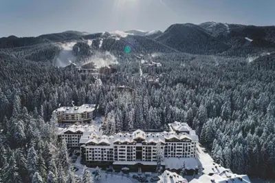 an aerial view of a resort with snow covered trees at Rustic Mountain Apartment - A55 in Borovets