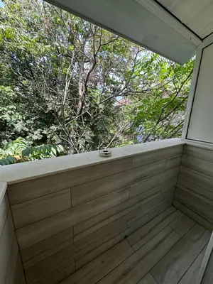 a balcony with a window in a house at Central Vista Apartment by MIT in Sofia