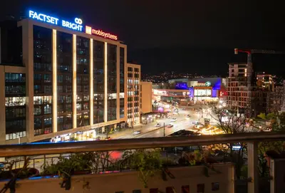a view of a city at night at Cozy Apartment with Mountain View & Parking in Sofia