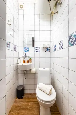 a bathroom with a toilet and a sink at House Of History , Rooms in the Main Street Plovdiv in Plovdiv