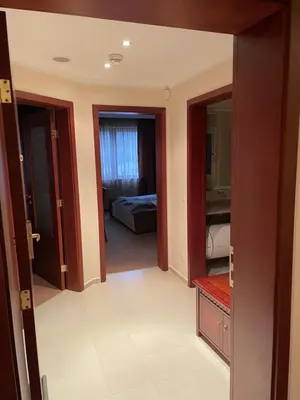 a view of a room with a bedroom and a bed at Bansko Downtown R LUX apartment in Bansko
