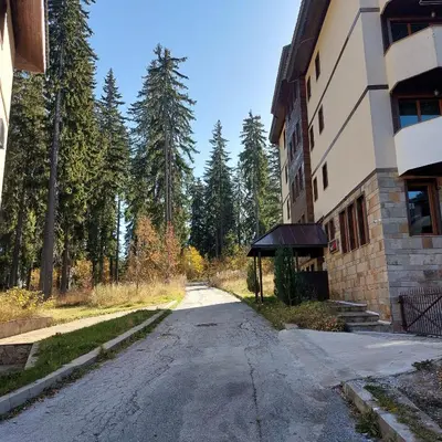 an empty street in front of a building at Апартамент Николови Пампорово in Pamporovo