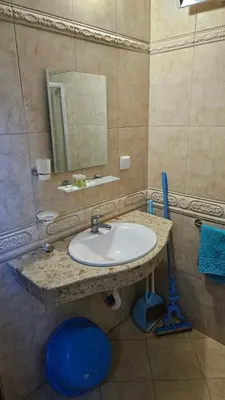 a bathroom with a sink and a mirror at Апартамент Николови Пампорово in Pamporovo