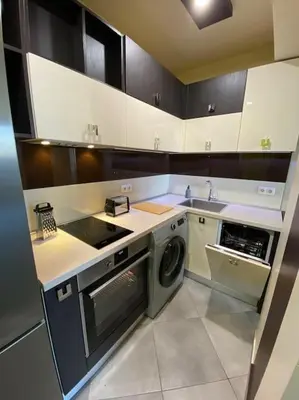 a kitchen with a stove and a sink and a dishwasher at Modern 1BR Apartment with Garden View & Free street parking in Plovdiv