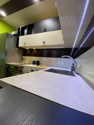 a kitchen with a white counter and a sink at Modern 1BR Apartment with Garden View & Free street parking in Plovdiv