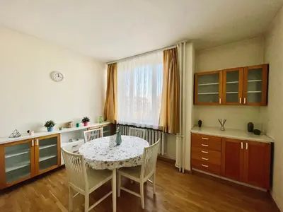 a kitchen with a table and chairs and a window at 2-BDR Flat Near the Mall, Spacious & Cozy by Flat Mаnager in Sofia