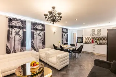 a living room with a couch and a table at Апартаменти Стефани in Plovdiv