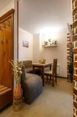 a living room with a couch and a table at Snow Line Suites SLS in Bansko