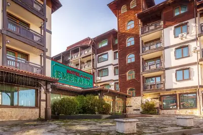 a building with a sign in front of it at Snow Line Suites SLS in Bansko