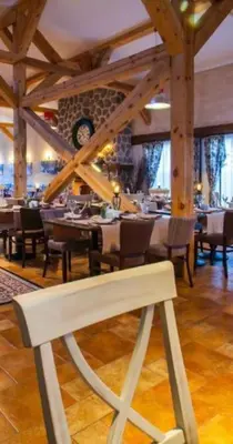 a dining room with tables and chairs in a restaurant at Apartment in Bansko in Bansko