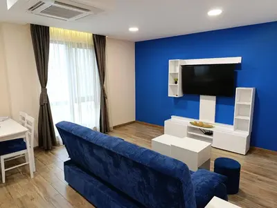 a blue living room with a blue wall at Lime House, Kyustendil in Kyustendil