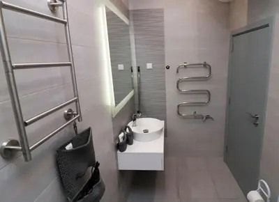 a bathroom with a sink and a mirror at Unique Central 1 Bedroom Flat in Sofia