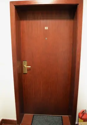 a wooden door with a handle in a room at Elinor Apartment - Downtown in Bansko