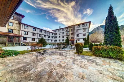 a view of a hotel with mountains in the background at Complex Silver Hills in Smolyan