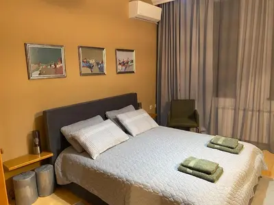 a bedroom with a bed with two pillows on it at Cozy mountain apartament near the Gondola lift in Bansko