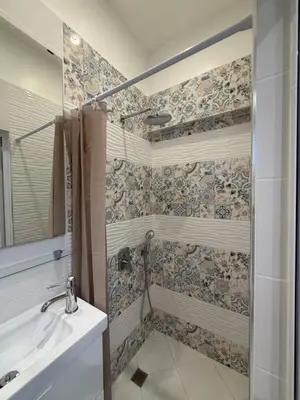 a bathroom with a shower and a sink at Graf Ignatiev Central Apartment in Sofia