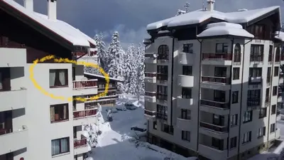 a apartment building with snow on top of it at Flora Clover One Bedroom Apartment nr. 18 in Borovets