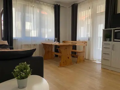 a living room with a couch and a table at Flora Clover One Bedroom Apartment nr. 18 in Borovets
