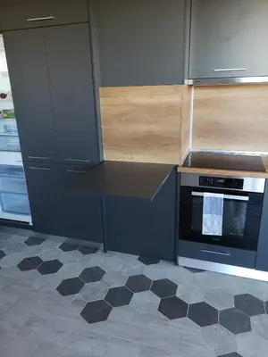 a kitchen with a black counter and a stove at Apartment Opalchenska / Pirotska in Sofia