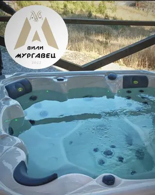 a jacuzzi tub with themama mykonos sign in at Boutique Villas Murgavets Pamporovo in Pamporovo