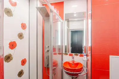 a bathroom with a red sink and a shower at Your home away from home in Sofia